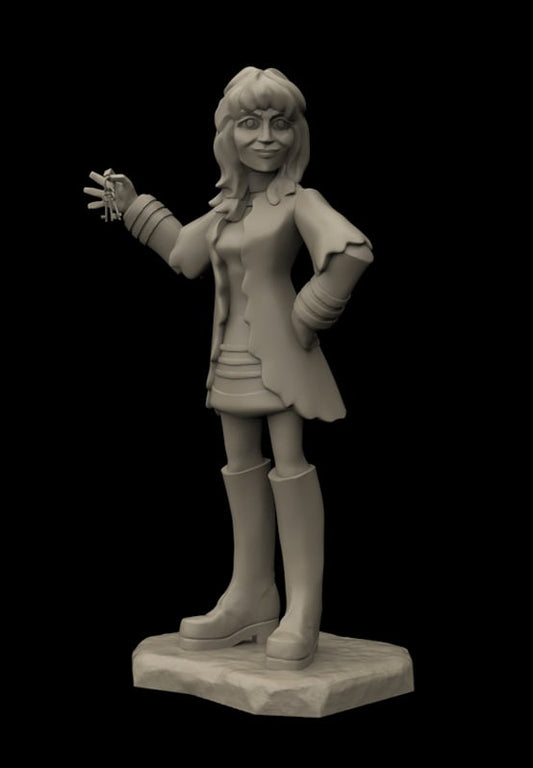 A monochrome 3D-printed figurine of a cartoon-style girl with glasses, wearing a coat, skirt, and tall boots, standing on a textured base against a solid black background.